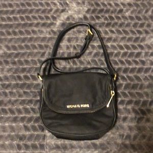 Michael Kors Black crossbody purse.
